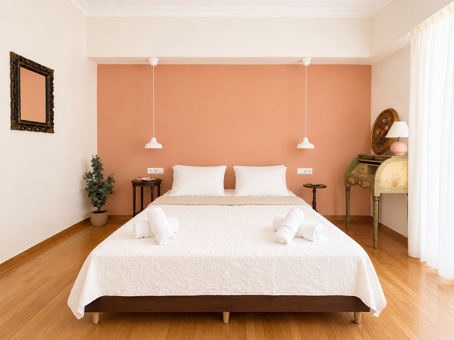 Centered bedroom composition with vintage desk and peach-toned wall