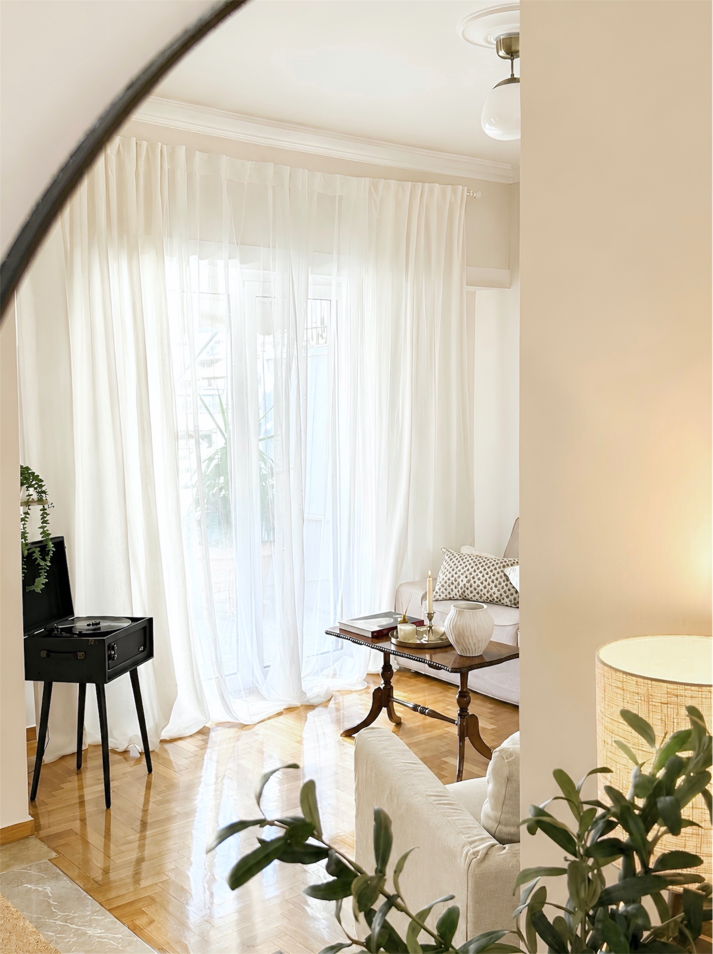Sheer curtains and afternoon light in the living room
