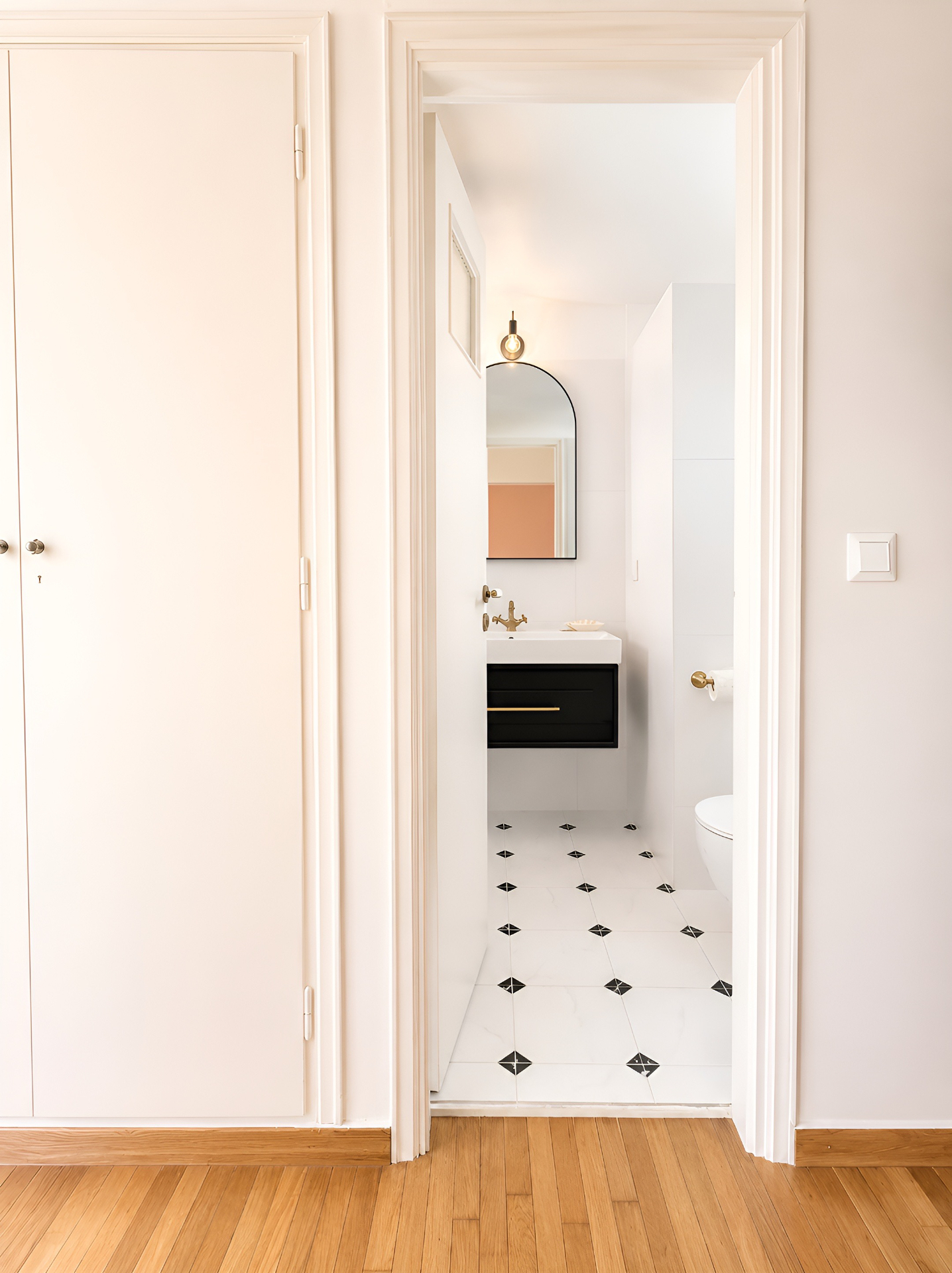 Bedroom doorway opening onto the ensuite bathroom